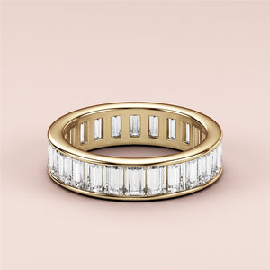 Stunning emerald channel eternity band in 14K or 18K yellow gold, perfect for weddings or anniversaries. 