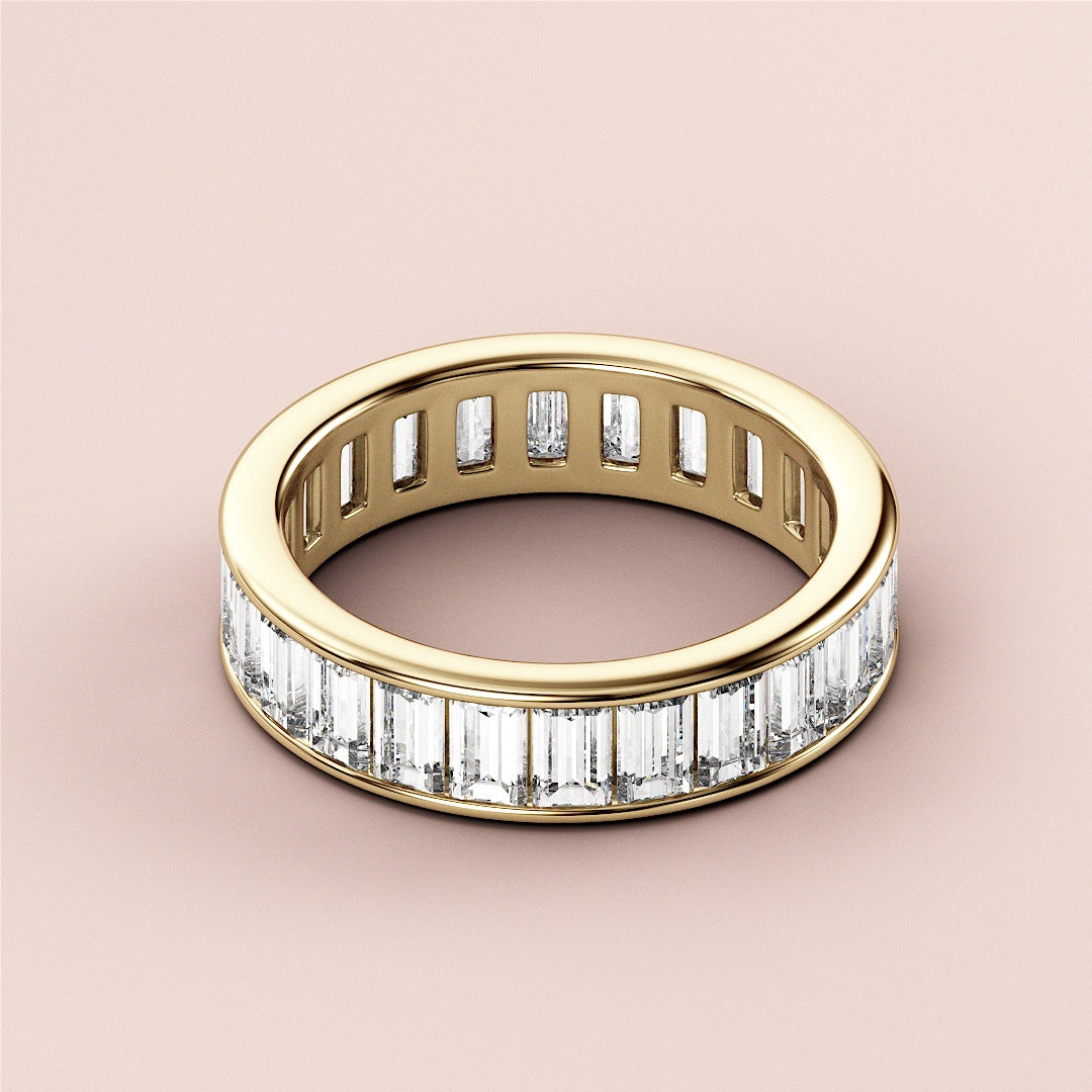 Luxurious 14K yellow gold eternity wedding band with channel-set emerald-cut diamonds, elegantly crafted and unmodeled. |
 
 
 #14KRecycledYellowGold
 #18KRecycledYellowGold
