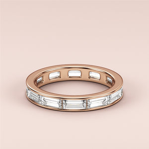 Rose gold wedding band featuring sparkling baguette-cut diamonds, available in 14K, 18K gold or platinum, perfect for eternity. 