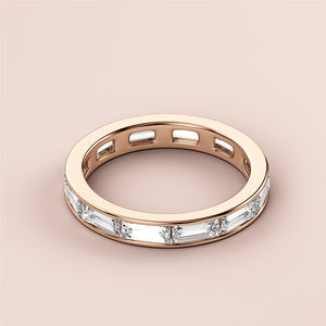 14K Rose Gold Eternity Band with Emerald Cut Diamonds, perfect for wedding celebrations and timeless elegance. 