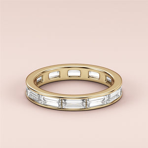 Elegant women's wedding band featuring baguette-cut diamonds in a yellow gold band, available in 14K, 18K, or platinum. 