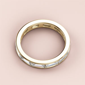 Elegant 14K gold wedding band featuring radiant baguette-cut diamonds in a timeless eternity design. Perfect for a lasting love. 