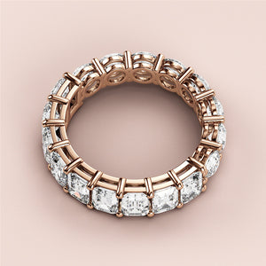 Rose gold eternity wedding band with emerald-cut diamonds, available in 14K and 18K gold or platinum. 