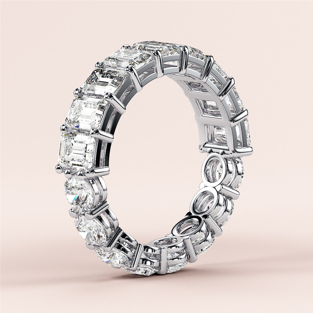 14K or 18K white gold eternity wedding band with emerald-cut diamonds, perfect for special occasions, shown on model's hand. 