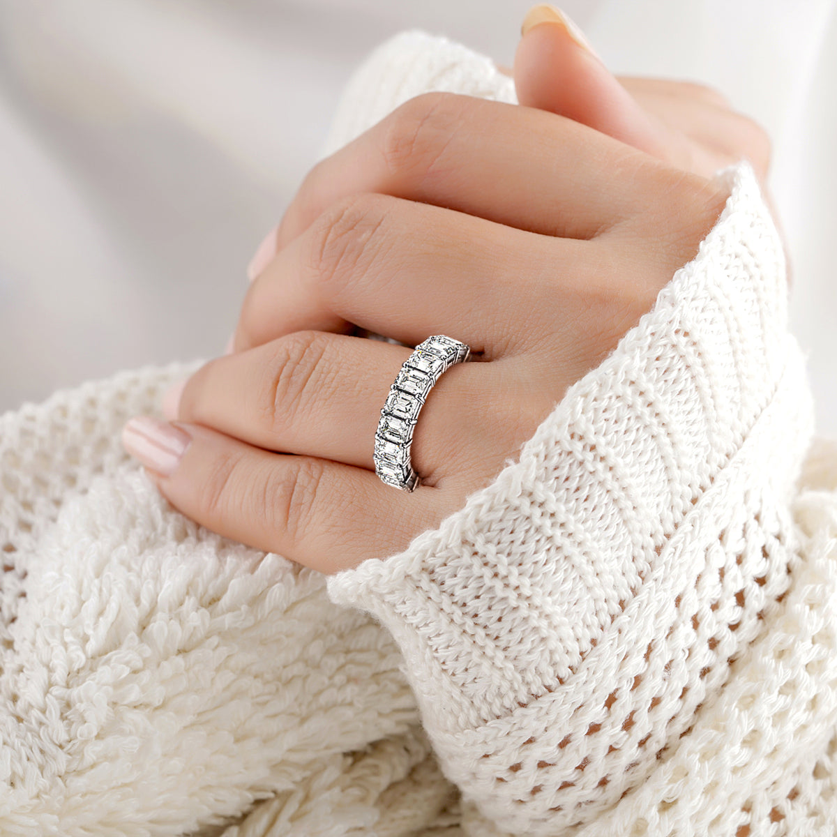 Elegant 14K/18K Gold or Platinum Wedding Eternity Band Featuring Emerald-Cut Diamonds on Model's Hand. 