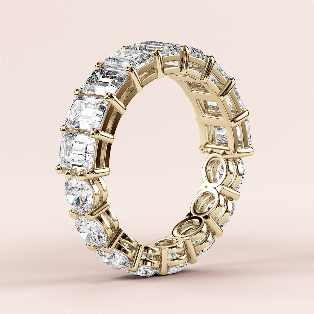 Elegant yellow gold wedding band, 14K or 18K, featuring emerald-cut diamondsâ€”timeless eternity design for luxurious style. 
