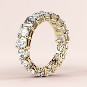 Elegant yellow gold wedding band, 14K or 18K, featuring emerald-cut diamondsâ€”timeless eternity design for luxurious style. 
