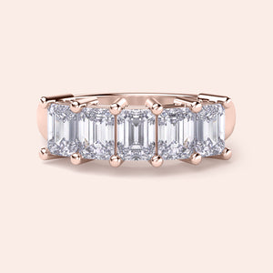 14K or 18K rose gold wedding band featuring a stunning emerald-cut diamond center, perfect for elegant occasions. 
