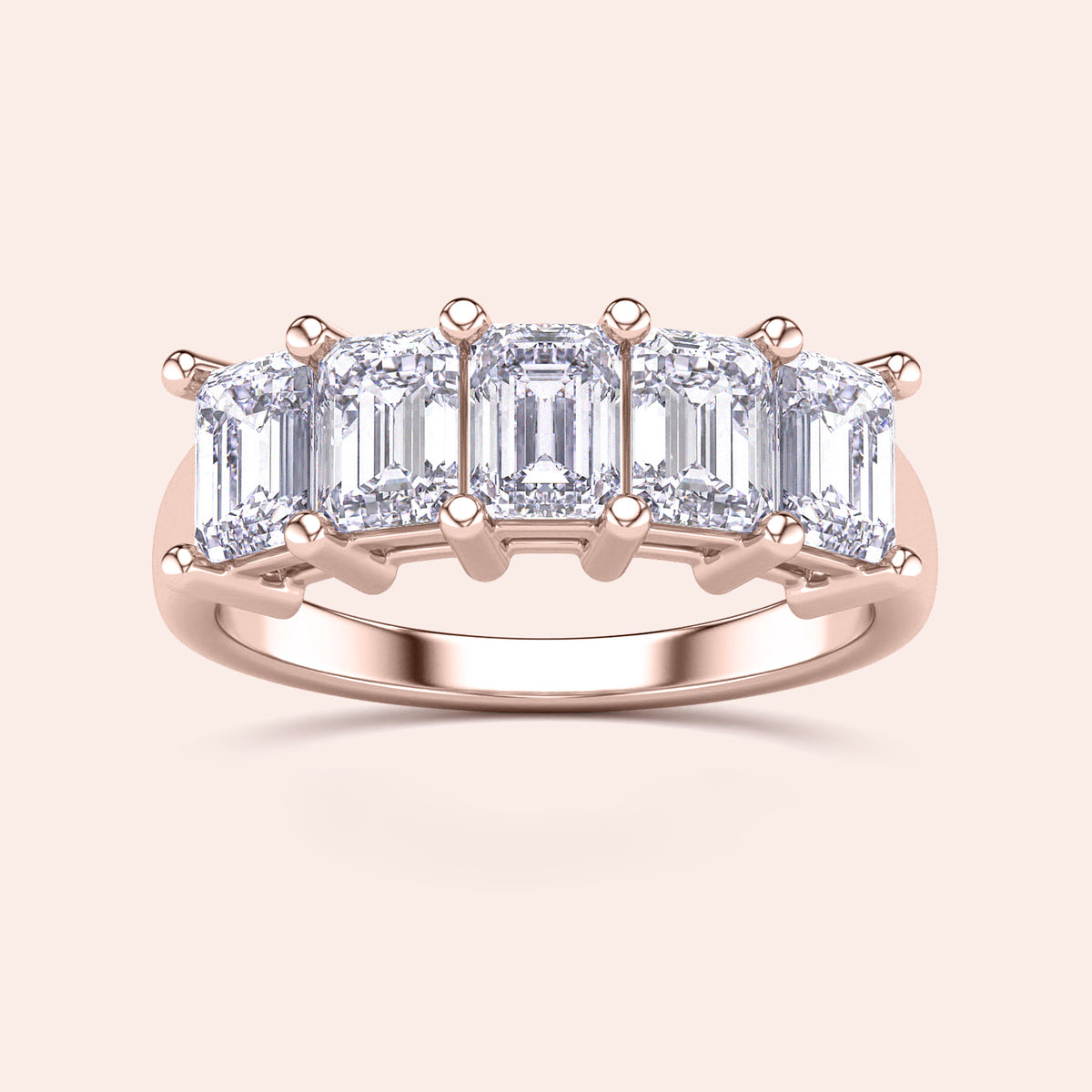 Elegant rose gold wedding band featuring four step-cut diamonds, available in 14K, 18K, or platinum, highlighting timeless design. 