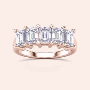 Elegant rose gold wedding band featuring four step-cut diamonds, available in 14K, 18K, or platinum, highlighting timeless design. 