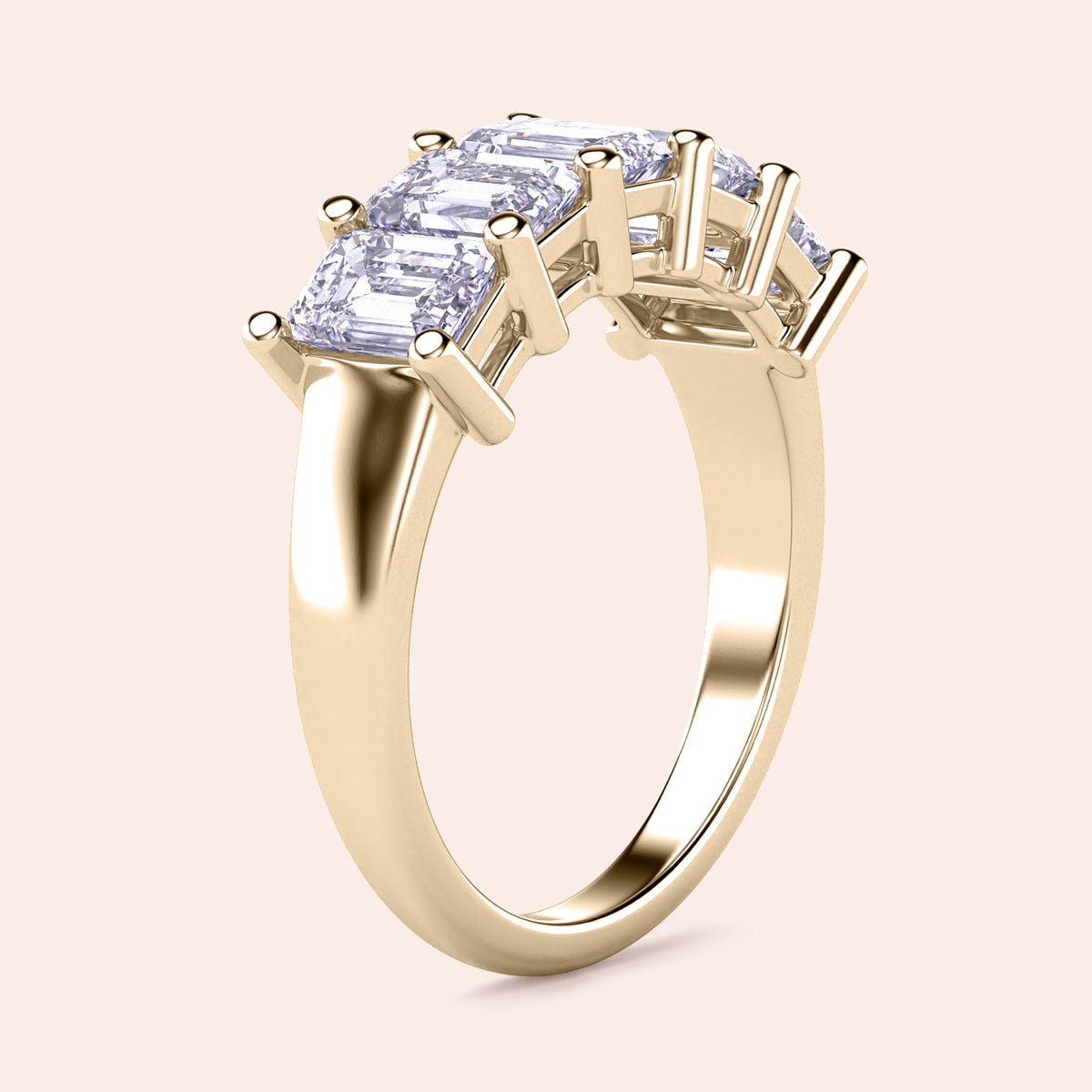 Elegant yellow gold five-stone emerald-cut wedding band in 14K or 18K, featuring sparkling diamonds in a classic prong setting. 