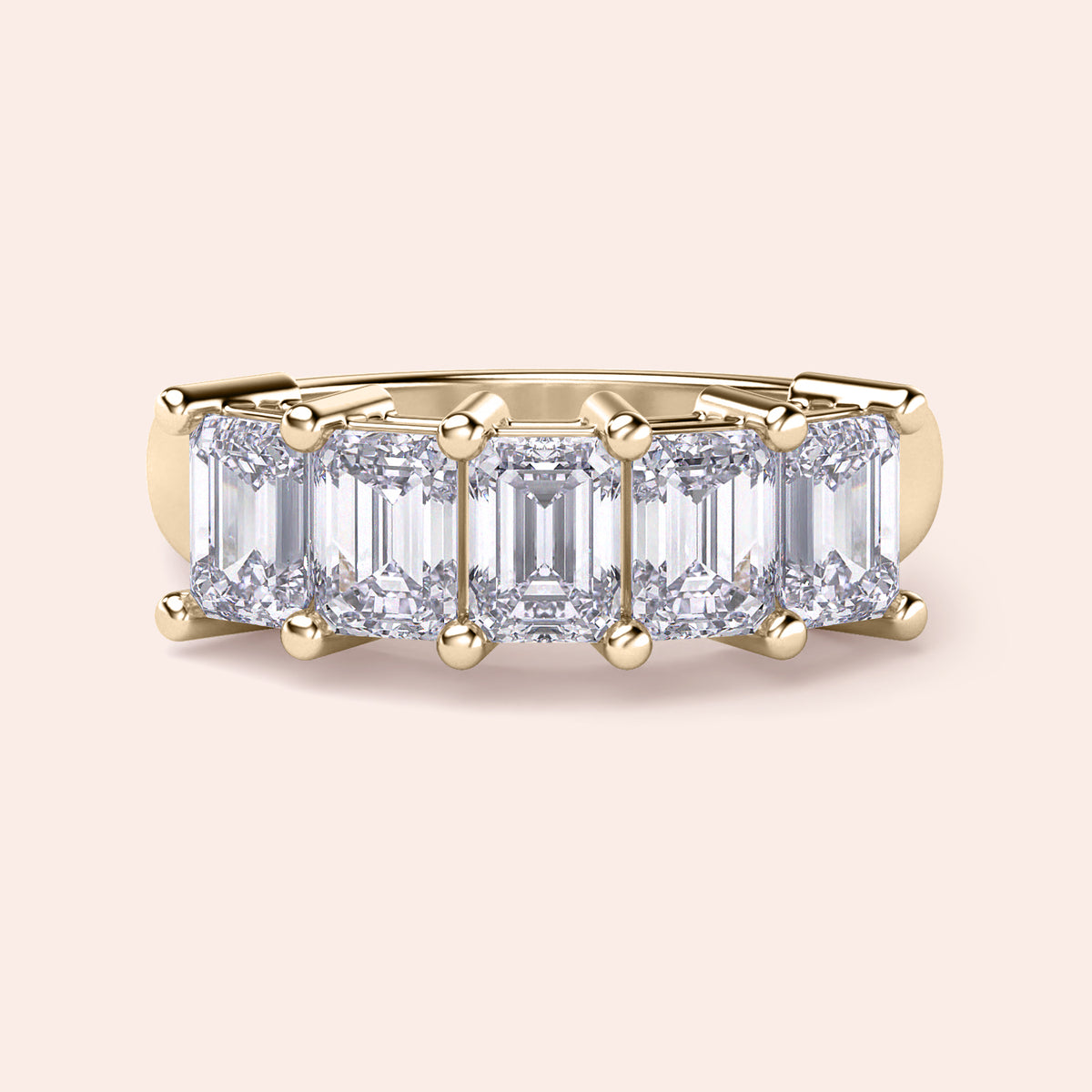 Stunning 14K Yellow Gold wedding band featuring a five-stone emerald-cut diamond design for a timeless and elegant look. 