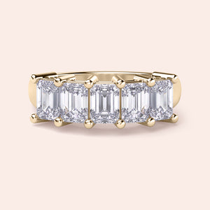 Stunning 14K Yellow Gold wedding band featuring a five-stone emerald-cut diamond design for a timeless and elegant look. 
