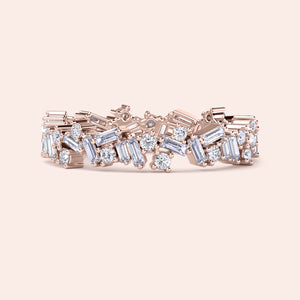 Rose gold wedding band featuring alternating round and baguette-shaped diamonds, available in 14K, 18K, or platinum. 