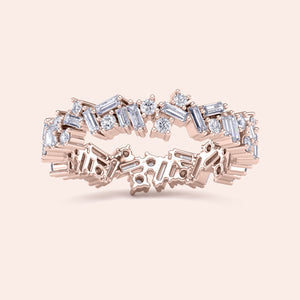 Elegant 14K or 18K rose gold eternity band featuring round and baguette diamonds in a stunning starburst design. 