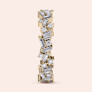 Elegant 14K and 18K gold eternity wedding band with round and baguette diamonds, shown on a neutral background. 