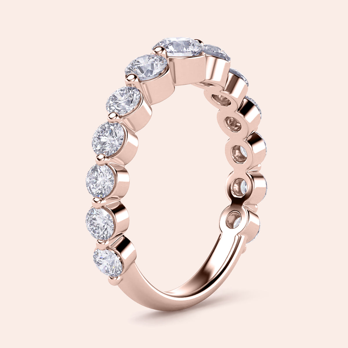 Elegant 14K rose gold wedding band featuring shared prong round-cut diamonds, ideal for special occasions and everyday elegance. 