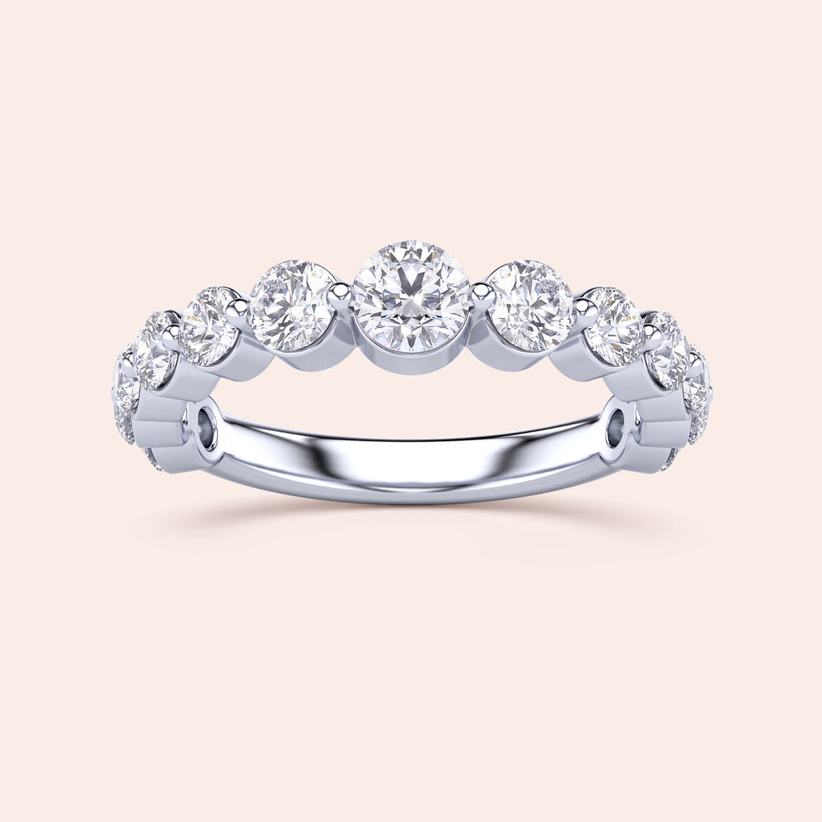 Elegant 14K/18K gold or platinum half eternity wedding band with round brilliant-cut diamonds in a sleek prong setting. 