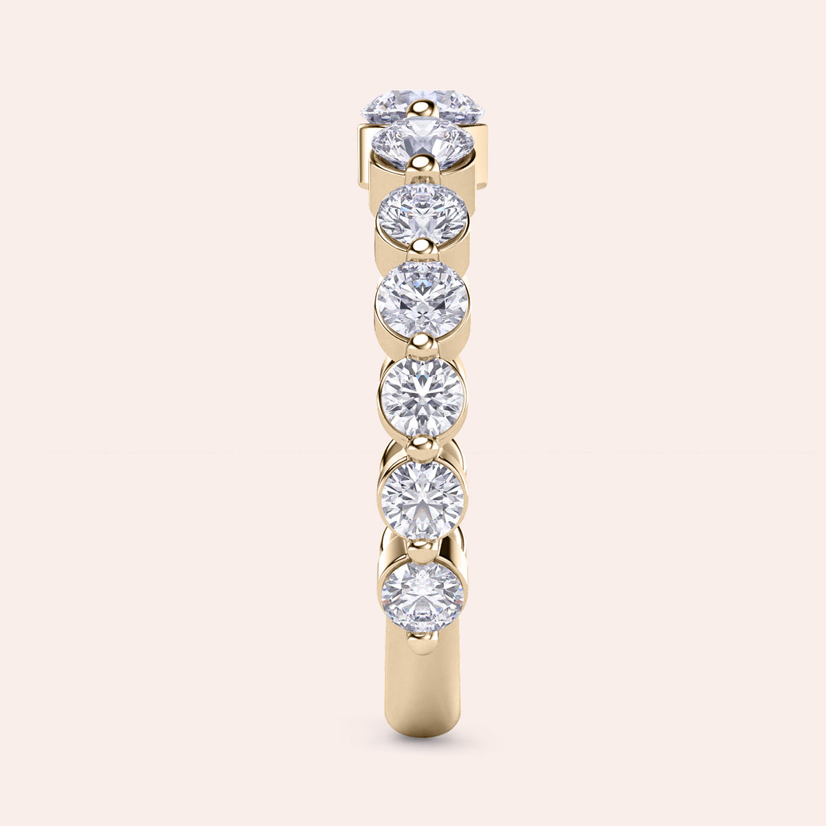 Elegant 14K gold wedding band featuring round-cut diamonds, showcasing luxurious design and exquisite craftsmanship, not worn on model. 
