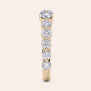 Elegant 14K gold wedding band featuring round-cut diamonds, showcasing luxurious design and exquisite craftsmanship, not worn on model. 