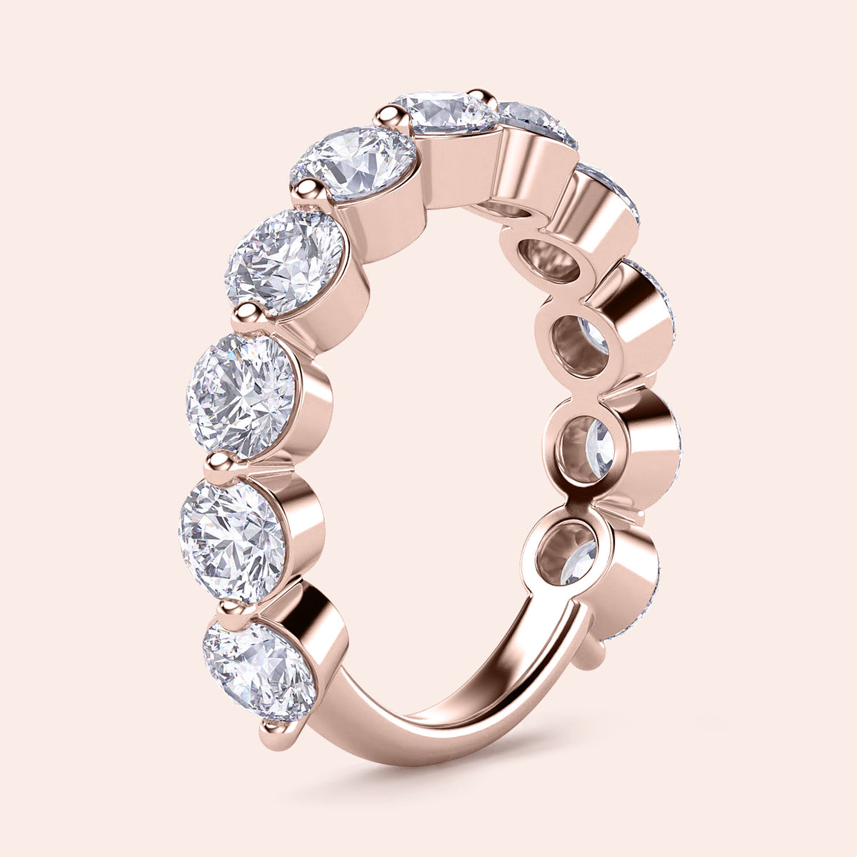 Rose gold wedding band featuring round brilliant-cut diamonds; available in 14K, 18K, or platinum settings. 