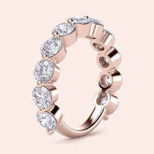 Rose gold wedding band featuring round brilliant-cut diamonds; available in 14K, 18K, or platinum settings. 