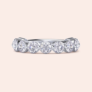 Elegant white gold wedding band featuring round brilliant-cut diamonds, available in 14K, 18K, and platinum settings. 