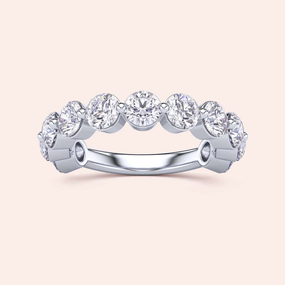 Elegant 14K/18K white gold eternity ring with round brilliant cut diamonds in a bezel setting, perfect as a wedding band. 