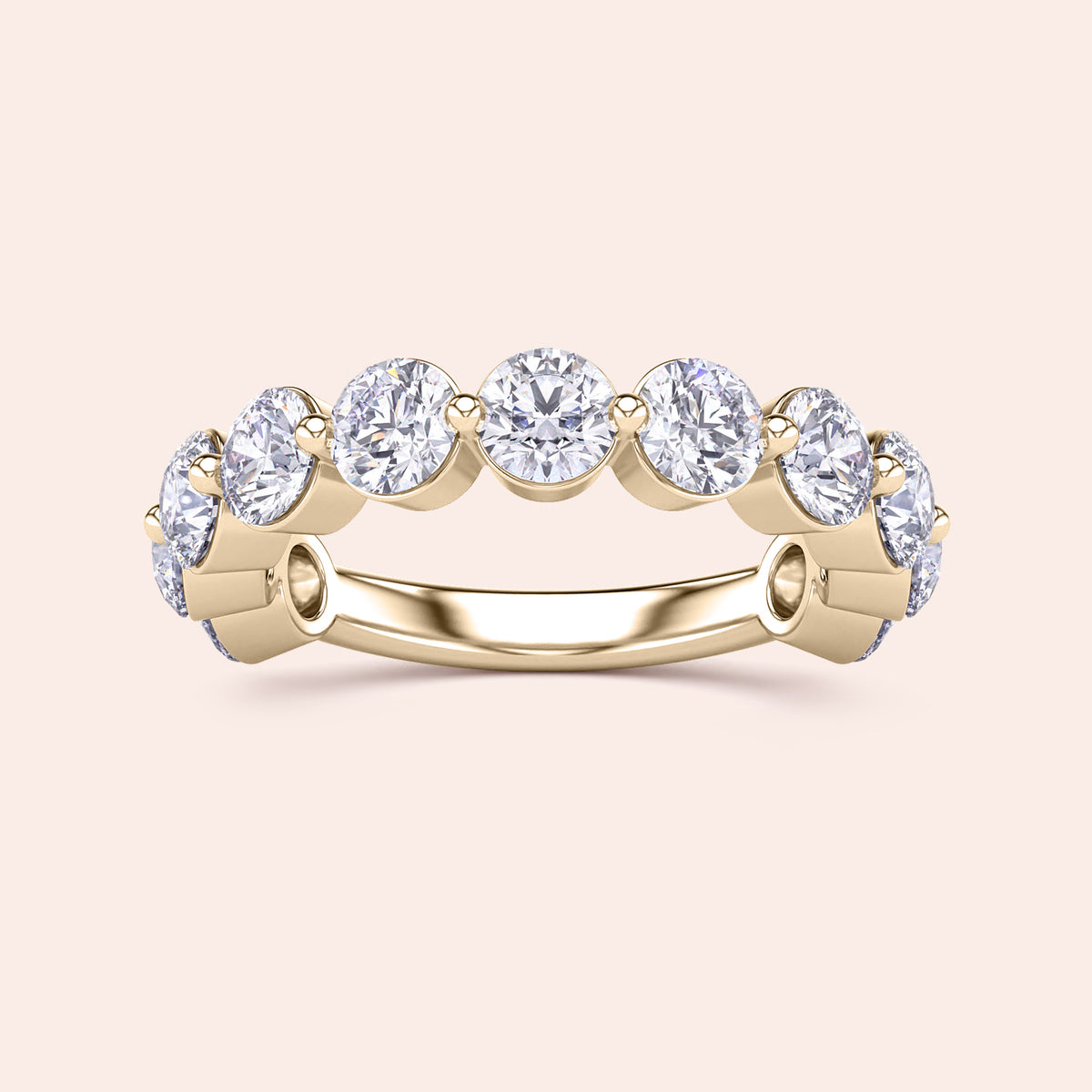 Elegant 14K and 18K yellow gold wedding band featuring round-cut diamonds, perfect for adding luxury to your jewelry collection. 