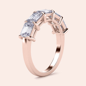 Elegant 14K rose gold wedding band featuring five emerald-cut diamonds, perfect for special occasions or everyday elegance. 
