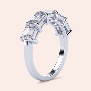 14K or 18K white gold wedding band featuring five radiant baguette-cut diamonds in a prong setting.  Elegant and timeless design. 
