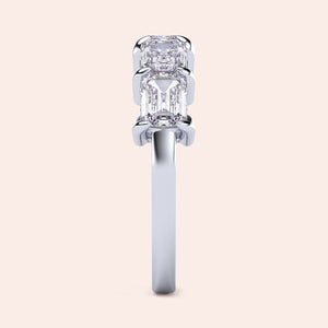 Elegant 14K or 18K white gold wedding band featuring five emerald-cut diamonds in an exquisite east-west setting. 