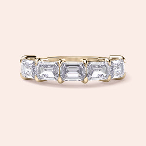 Elegant 14K and 18K gold wedding band featuring three emerald-cut diamonds, exuding timeless sophistication and luxury.