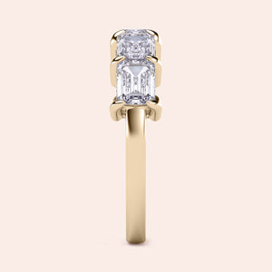Elegant emerald-cut diamond wedding band in 14K or 18K gold or platinum, featuring five stunning diamonds in a prong setting. 