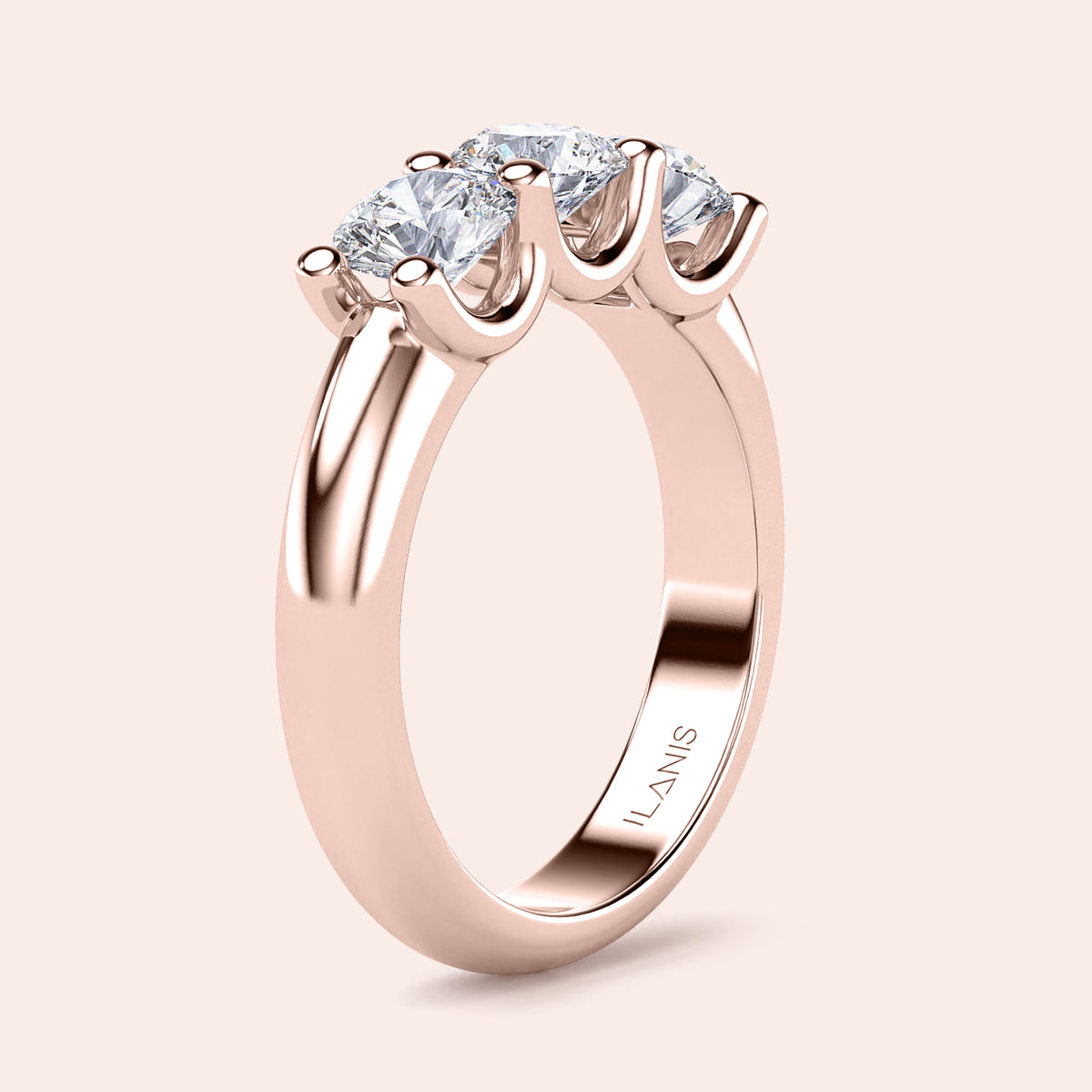 Rose gold wedding band featuring three stunning stones, available in 14K, 18K, and platinum for an elegant and timeless design. 