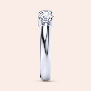 Elegant three-stone diamond wedding band in 14K or 18K white gold, featuring round brilliant-cut diamonds. Jewelry not worn. 