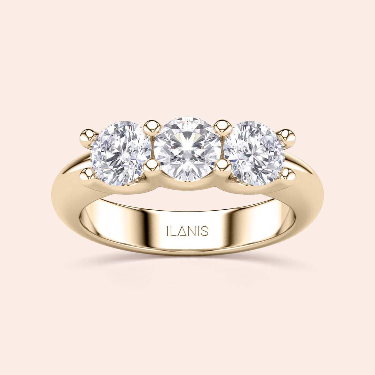 Elegant round three-stone wedding band in polished 14K or 18K gold, showcasing timeless sophistication and luxurious design. 