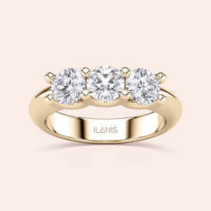 Elegant round three-stone wedding band in polished 14K or 18K gold, showcasing timeless sophistication and luxurious design. 
