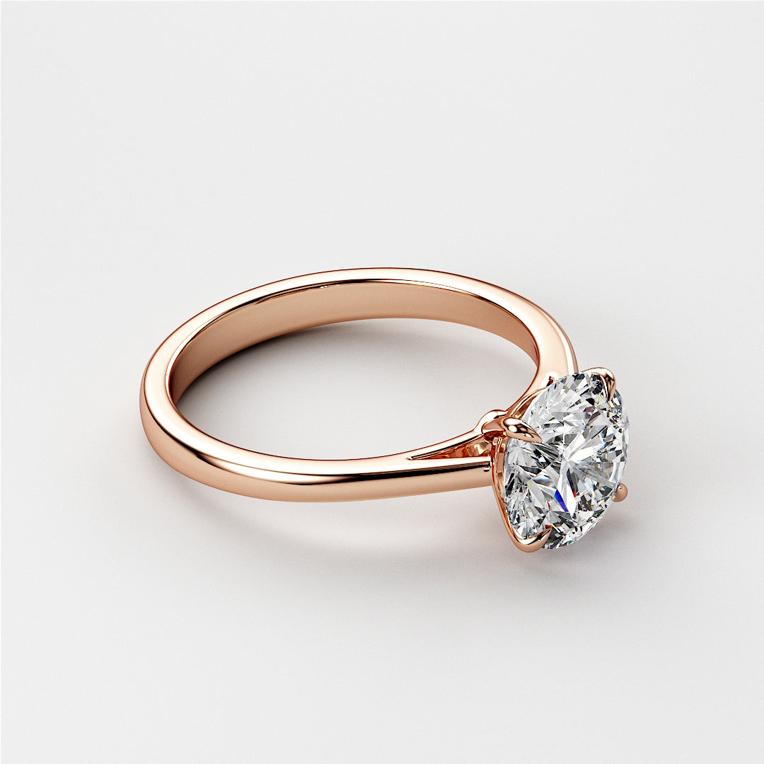 Elegant 14K or 18K rose gold solitaire engagement ring with a round brilliant-cut diamond on a minimalistic backdrop.|







#14KRecycledRoseGold
#18KRecycledRoseGold


