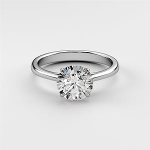 "Elegant 14K or 18K white gold solitaire engagement ring with round-cut diamond in a polished cathedral setting."