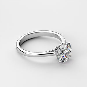 Round diamond solitaire engagement ring in 14K or 18K white gold, shown on a white background. Timeless elegance for your special moment.