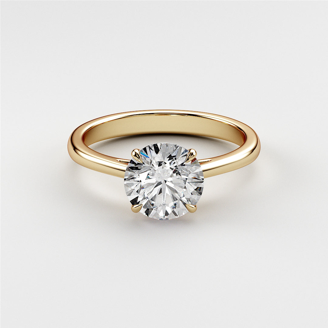 "Elegant 14K yellow gold solitaire engagement ring featuring a round diamond in a classic prong setting, showcasing timeless beauty."|




#14KRecycledYellowGold
#18KRecycledYellowGold





