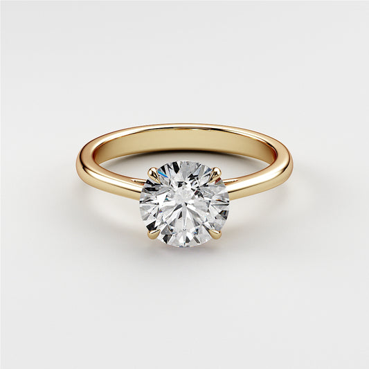 "Elegant 14K yellow gold solitaire engagement ring featuring a round diamond in a classic prong setting, showcasing timeless beauty."