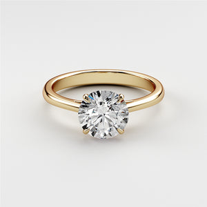 "Elegant 14K yellow gold solitaire engagement ring featuring a round diamond in a classic prong setting, showcasing timeless beauty."