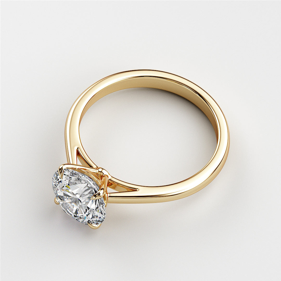 "Elegant 14K or 18K yellow gold solitaire engagement ring featuring a classic round diamond in a cathedral setting."|




#14KRecycledYellowGold
#18KRecycledYellowGold





