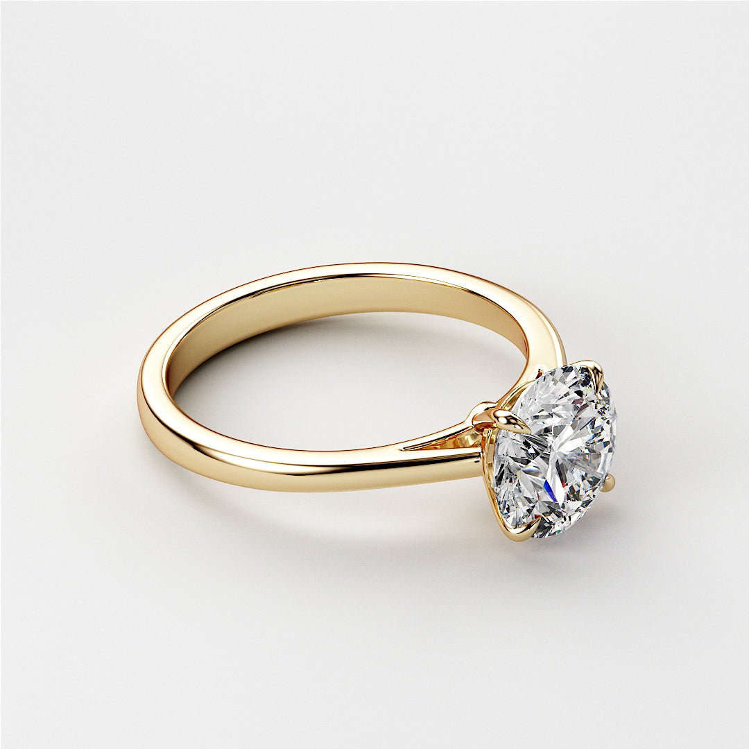 Elegant 14K yellow gold solitaire engagement ring featuring a brilliant round-cut diamond, showcased on a model.|




#14KRecycledYellowGold
#18KRecycledYellowGold





