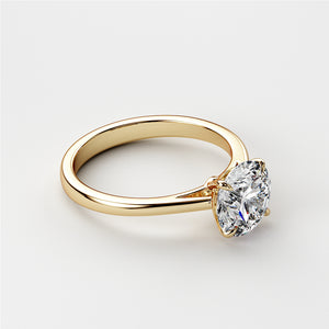 Elegant 14K yellow gold solitaire engagement ring featuring a brilliant round-cut diamond, showcased on a model.