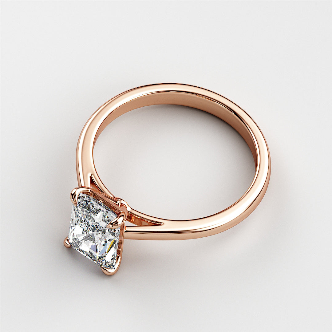 Elegant 14K rose gold solitaire engagement ring featuring a princess-cut diamond, perfect for timeless proposals.|







#14KRecycledRoseGold
#18KRecycledRoseGold


