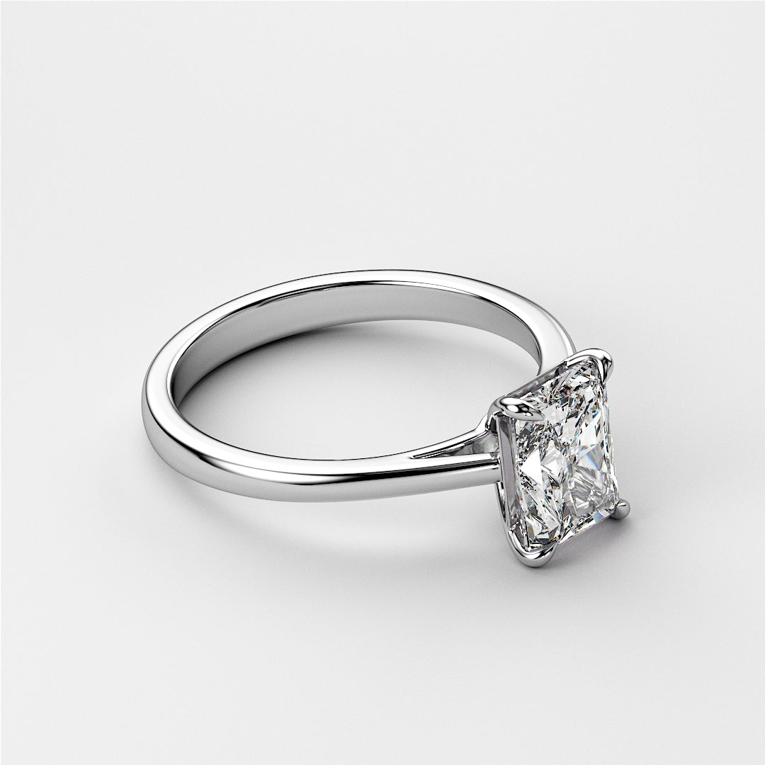 Elegant solitaire engagement ring featuring a radiant cut diamond on a sleek 14K or 18K white gold or platinum band.|

#14KRecycledWhiteGold
#18KRecycledWhiteGold








#Platinum