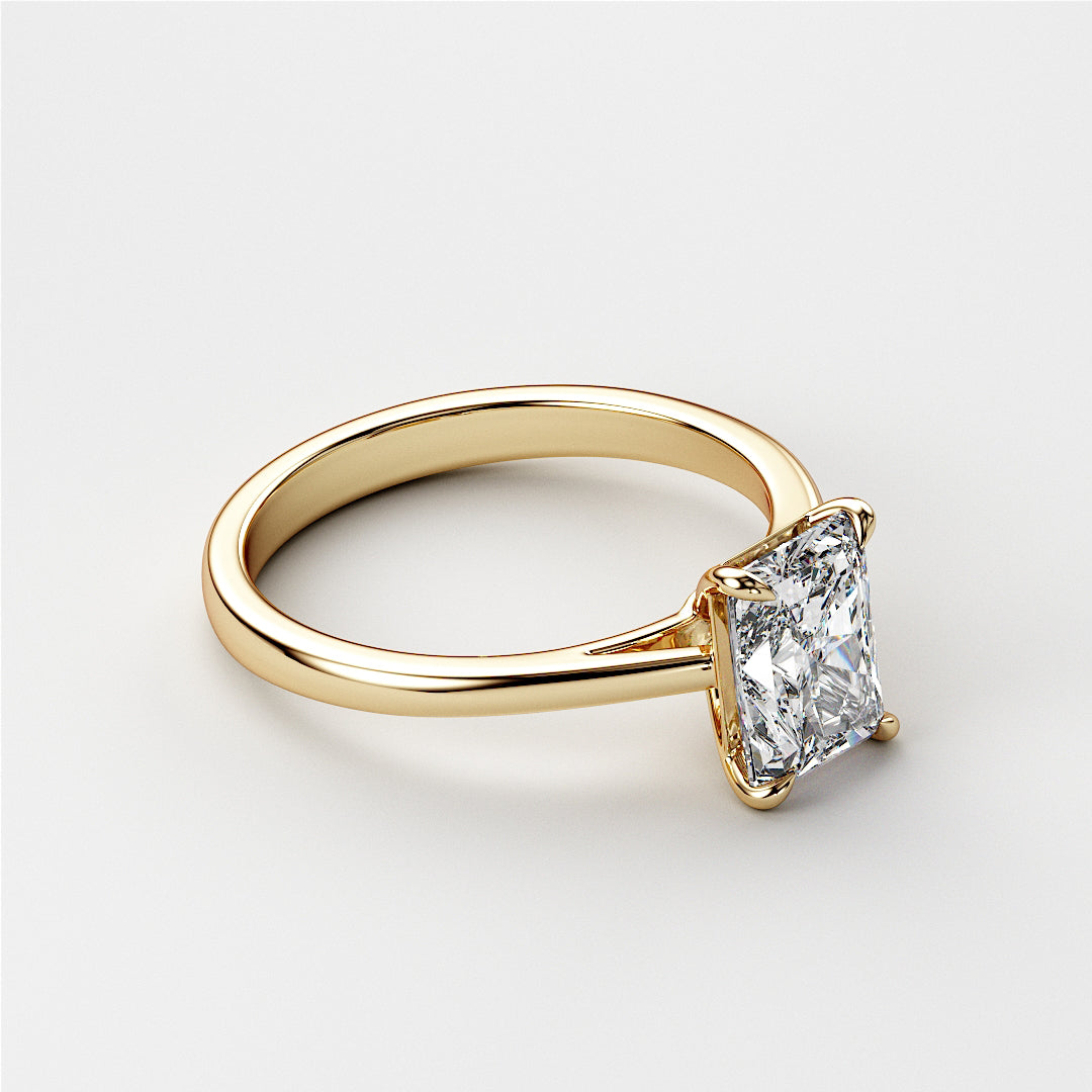 Elegant 14K or 18K yellow gold engagement ring with a radiant-cut diamond in a classic solitaire cathedral setting.|




#14KRecycledYellowGold
#18KRecycledYellowGold





